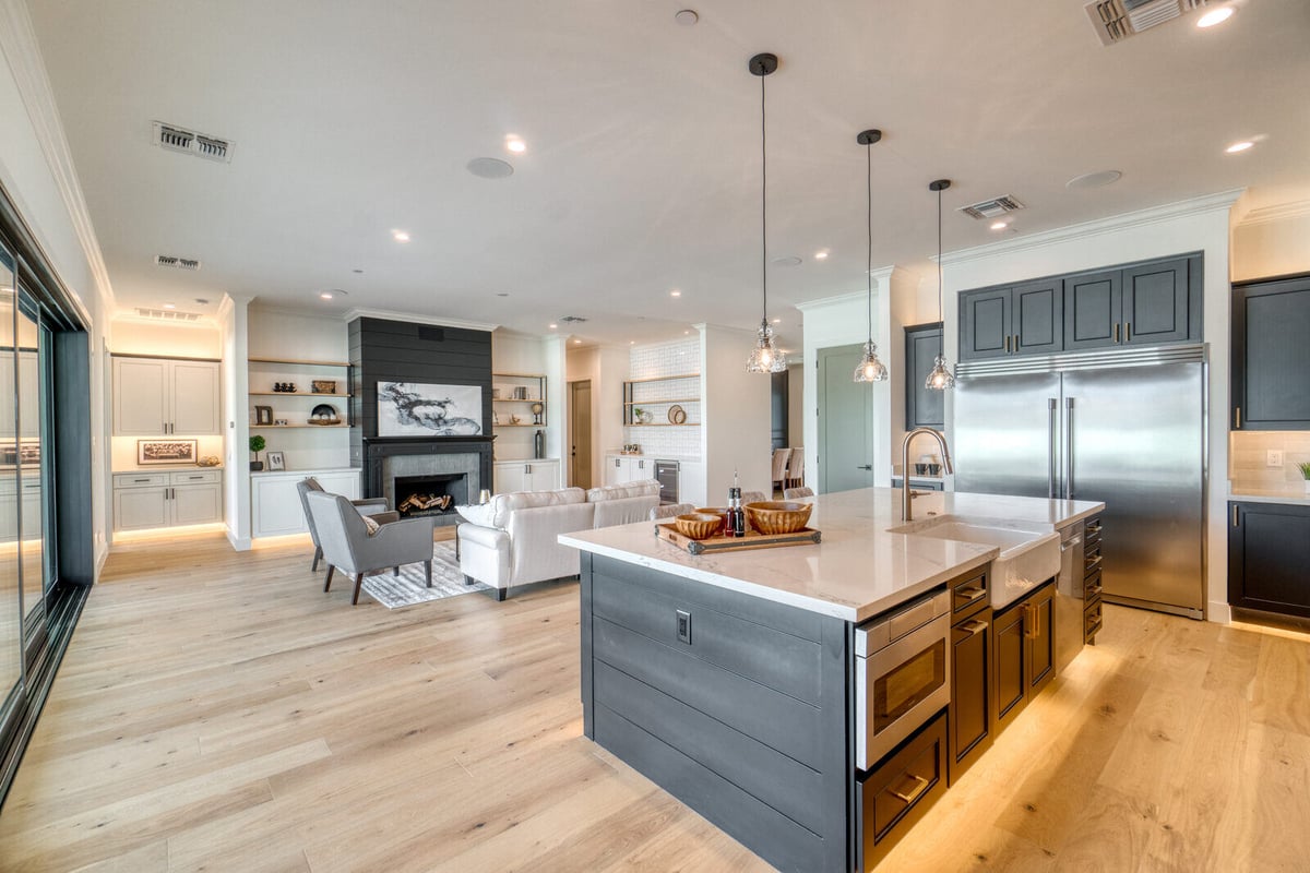 Luxury kitchen remodel by Truelux Fine Homes in Austin, Texas with open layout and modern island